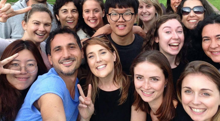 Group selfie of a group of smiling english language students