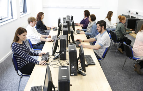 ih dublin students in a computer room in their english lesson